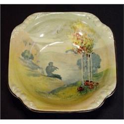 Royal Doulton dish hand coloured and transfer printed with Pan amongst fields, marks to base, 14c…