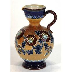 Doulton Lambeth stoneware jug decorated with a raised band of stylised flowers, impressed marks a…