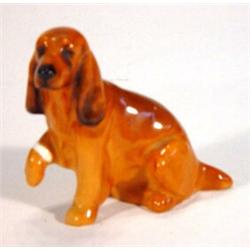 Hand painted Royal Doulton Labrador with raised paw, marks to base, 6cm high…