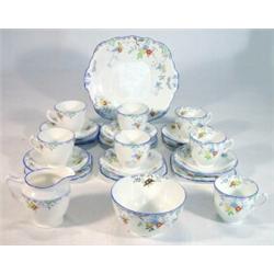 Seven place hand coloured and transfer printed floral Sutherland china teaset…