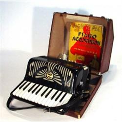 Cased Elbazzanni Parma accordion with leather straps…