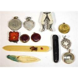 Selection of items including German legs corkscrew, hand painted parrot bookmark, silver football…