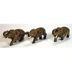 Three carved horn galloping elephants, 16cm in length…