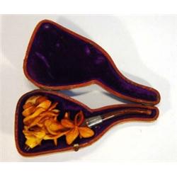 Cased silver collared meerschaum pipe heavily carved with flowers and leaves…