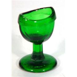 Moulded green glass eyebath, 6cm high…