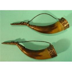 Pair of Russian silver and horn drinking horns, the silver bird's head mounts with black floral d…