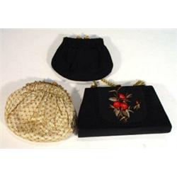 Two beaded clutch bags and a floral embroidered clutch bag…