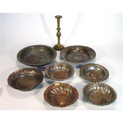 Selection of 18th and 19th century Islamic silvered copper and other dishes and an Islamic brass …