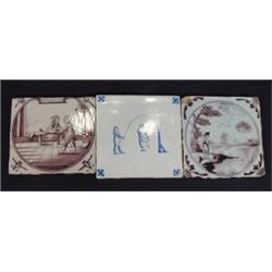 Two purple hand painted Dutch Delft tiles, one of a landscape scene and one of two people inside …