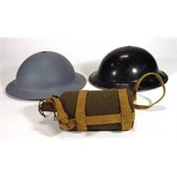 Black painted military WW2 tin hat, a grey tin hat and a khaki military water bottle…