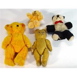 Straw filled jointed teddy bear, toy panda and two other jointed teddy bears, largest 29cm high…