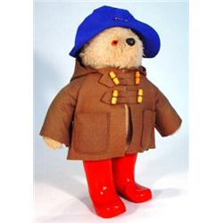 Gabriel Paddington Bear with brown overcoat and red wellington boots, label to back, 52cm high…