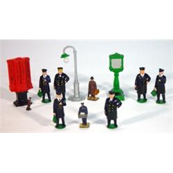 Selection of hand painted lead railway guardsmen, pedestrians, vending machine and a street lamp…