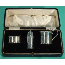 Boxed three piece silver cruet, comprising pepperpot, mustard and salt with blue glass liner, Che…