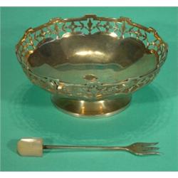 Pierced silver bonbon dish and silver pickle fork, largest 10cm diameter…