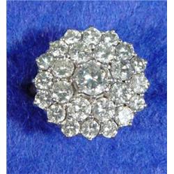 18ct gold platinum set flowerhead diamond ring, the central diamond approximately ½ct, set with a…