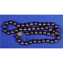 String of black cultured pearls…