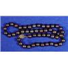 Image 1 : String of black cultured pearls…