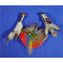 Silver claw foot brooch with purple stone, claw foot brooch with amber coloured stone and a feath…