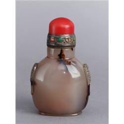 A TONGZHI AGATE SNUFF BOTTLE, handles i the shape, A TONGZHI AGATE SNUFF BOTTLE, handles i the...