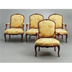 A set of four Louis XV polished red beech, A set of four Louis XV polished red beech ARMCHAIRS,...