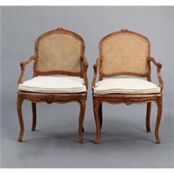 A pair of Louis XV cut and polished ARMCHAIRS,, A pair of Louis XV cut and polished ARMCHAIRS,...