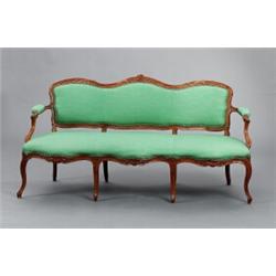 A French Louis XV cut walnut CANAPÉ, 178 cm, A French Louis XV cut walnut CANAPÉ, 178 cm long...