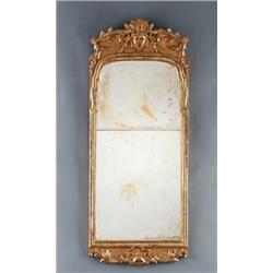 A Swedish rococo giltwood MIRROR, Stockholm, 144, A Swedish rococo giltwood MIRROR, Stockholm,...