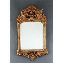 A Swedish rococo giltwood MIRROR, Stockholm, with, A Swedish rococo giltwood MIRROR, Stockholm,...