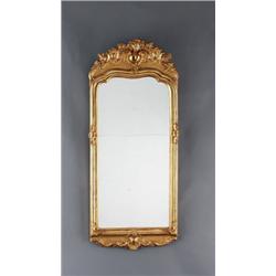 A Swedish rococo giltwood MIRROR, 121 x 51, A Swedish rococo giltwood MIRROR, 121 x 51 cm...