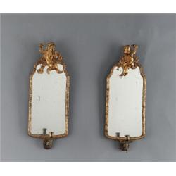 A pair of baroque gilt lead GIRANDOLES, in the, A pair of baroque gilt lead GIRANDOLES, in the...