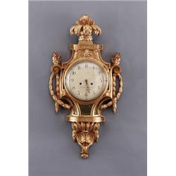 A Swedish late 18th century giltwood CARTEL, A Swedish late 18th century giltwood CARTEL CLOCK,...