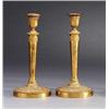 Image 1 : A pair of empire partly gilt bronze CANDLESTICKS,, A pair of empire partly gilt bronze CANDLEST...