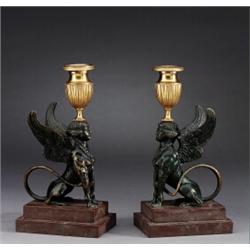 A pair of empire partly gilt and blackened bronze, A pair of empire partly gilt and blackened b...