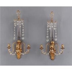 A pair of Louis XVI ormolu three-light BRAS DE, A pair of Louis XVI ormolu three-light BRAS DE...
