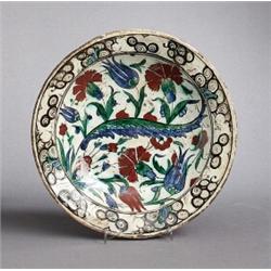 AN OSMANIAN IZNIK 17th CENTURY DISH, earthenwear,, AN OSMANIAN IZNIK 17th CENTURY DISH, earthen...