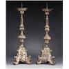 A pair of baroque silvered copper CHURCH, A pair of baroque silvered copper CHURCH CANDLESTICKS...