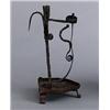 An 18th century or earlier wrought iron CANDLE, An 18th century or earlier wrought iron CANDLE...