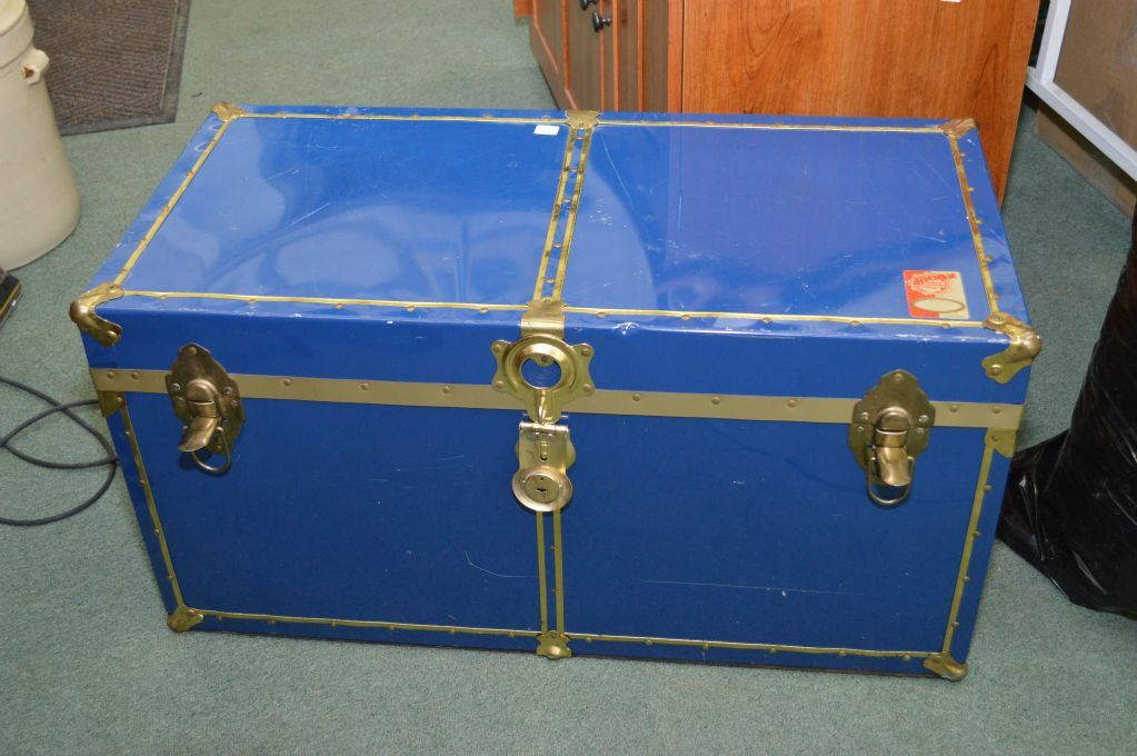 Small blue metal steamer trunk with tray
