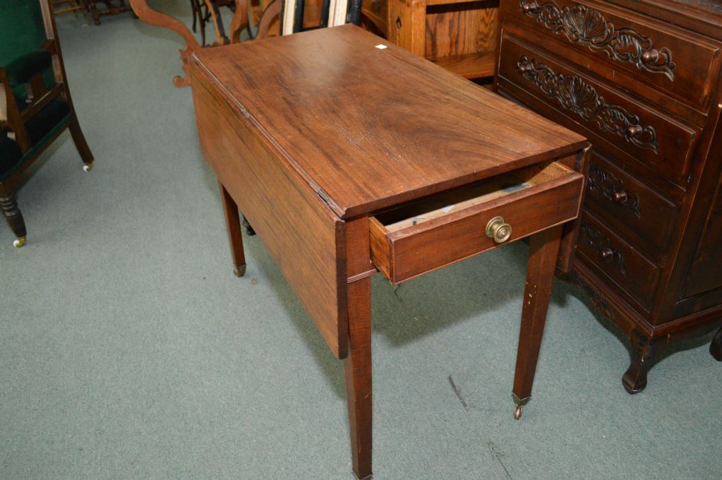 Antique drop leaf table with original brass castors and single drawer