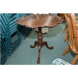 Large center pedestal occasional table with carved ball and claw feet, matched grain top and fully c