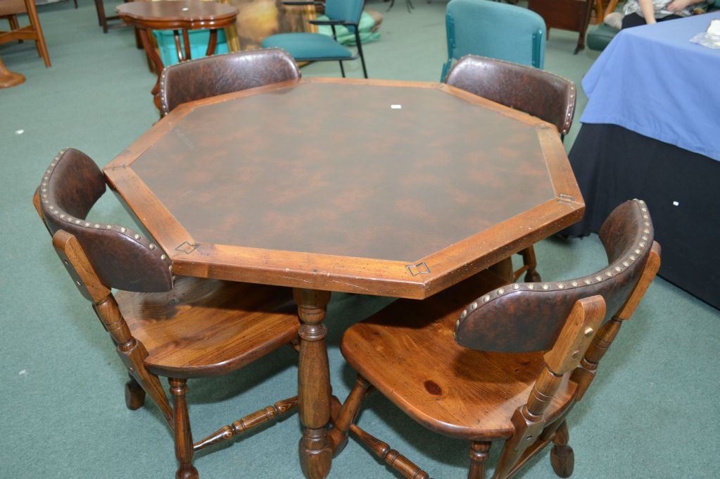 Octagonal games table with simulated leather top and four chairs