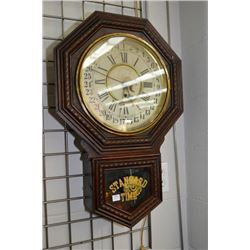 Vintage W.M.L Gilbert Clock Co. Winsted, Connecticut wood cased 31 day wall clock with visible pendu