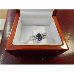RING - LADIES TANZANITE RING - .80CARAT - S1 CLARITY TANZANITE AND 12 CZ SET IN  STERLING SILVER - I