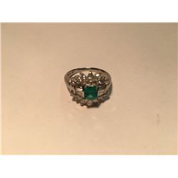 LADIES PLATINUM AND DIAMOND EMERALD DRESS RING. CENTER SET WITH ONE 0.5CT NATURAL