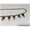 Image 2 : LADIES 10KT  YELLOW GOLD AND SAPPHIRE NECKLACE.  SET WITH 25.60CT OF OVAL AND ROUND BLUE AND WHITE