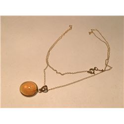LADIES 14KT YELLOW GOLD, OPAL AND DIAMOND PENDANT. SET WITH ONE OVAL SHAPED CABOCHON CUT  NATURAL