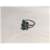 Image 2 : LADIES 18K WHITE GOLD EMERALD AND DIAMOND RING. SET WITH A ROUND CUT EMERALD APPROX. 0.