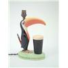 Image 1 : A Carltonware Guinness-advertising table lamp, 1950's, brightly painted Toucan standing upright b...