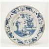 Image 1 : An 18th century Delft charger, probably Bristol, painted with a mandarin beside a jardiniere of f...